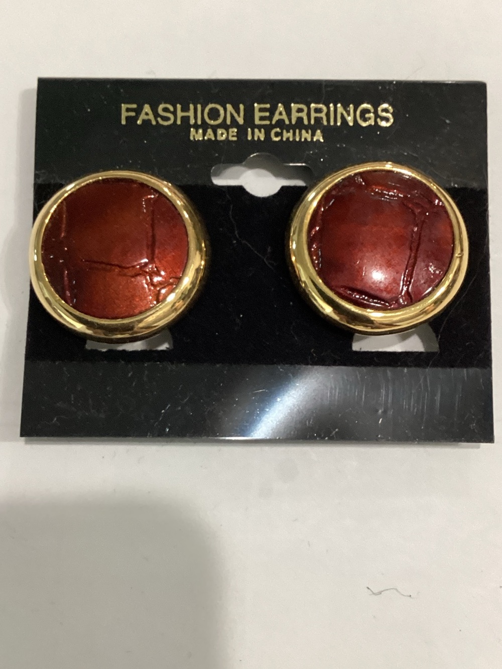 Gold-Trim Round clip on Earrings with Deep Red Centers